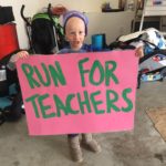 Seth holding Run for Teachers sign.2017